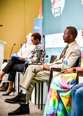 Charles Baraka Nteranya, Co-founder of Kilimo Green Farm, delivering a speech on sustainable agriculture and youth innovation at the Youth Connekt Africa Summit’24 in Kigali, @UNV, 2024. Photo credit: United Nations Volunteers